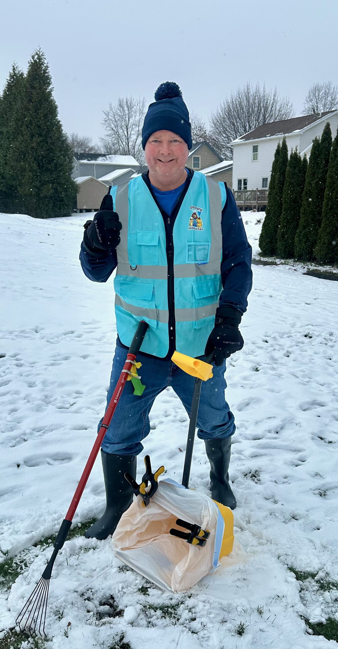 A Poopy Monster Technician Scooping Poop in a yard.